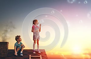 Boy and girl playing on the roof