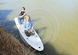 Boy and girl playing on surf