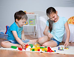 Boy and girl playing with toys