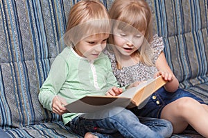 Boy and girl are reading book