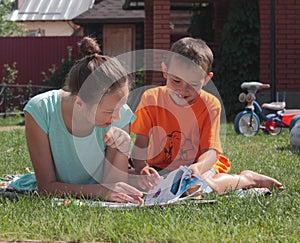 Boy and girl reading book