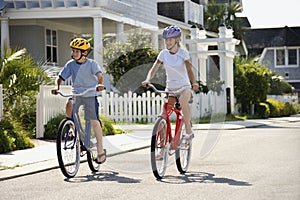 Boy and Girl Riding Bikes