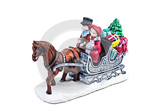 Boy and girl riding the Horsecar ,Christmas decoration ceramics, earthenware isolated on white background..