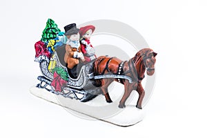 boy and girl riding the Horsecar ,Christmas decoration ceramics, earthenware isolated on white background...