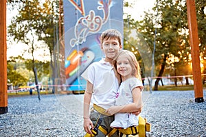 Boy and girl in rock climbing gym