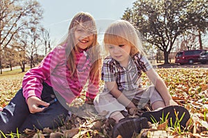 Boy and girl sitting in field