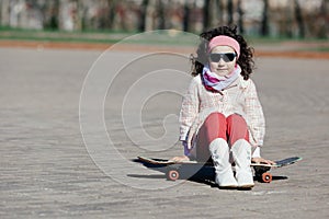 Boy and girl skating on the street