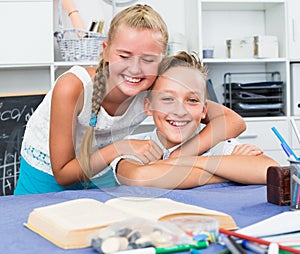 Boy with girl are smiling and embracing together