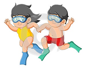 The boy and girl are swimming and diving together with the happy expression