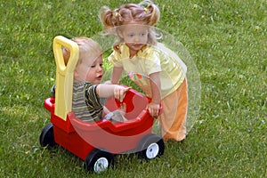 Boy And Girl With Wagon