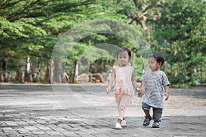 Boy and girl walking together and holding hand