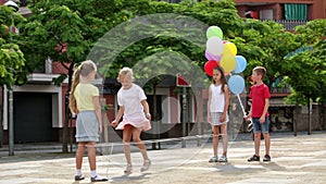 boy and girls jumping rope