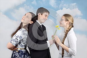 Boy gives flowers to girlfriend