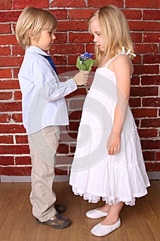 Boy gives a girl a bouquet flowers