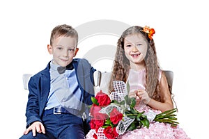 Boy gives a girl flowers on the day of St . Valentine