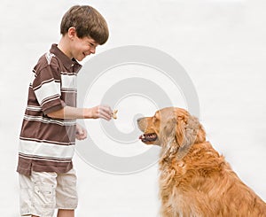 Boy Giving Dog a Reward