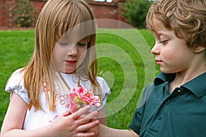 A boy giving flowers