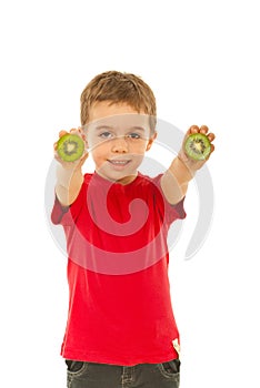 Boy giving slices kiwi