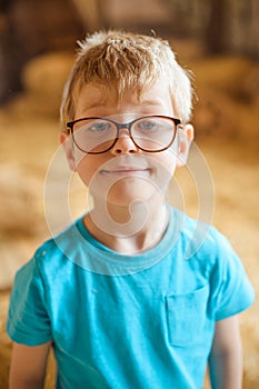 boy with glasses in a blue T-shirt