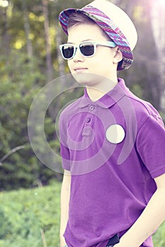 Boy with glasses hat summer day woods, outdoors resting one confident little man fashion style concept idea, shirt