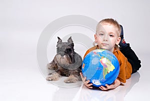 The boy, globe and a dog
