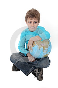 Boy with a globe in his lap