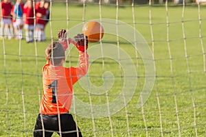 Boy goalkeeper defends
