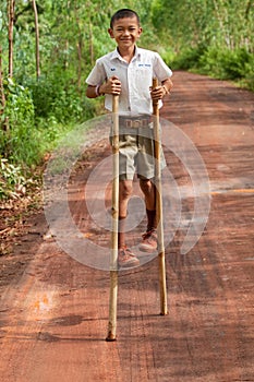 Boy goes on stilts