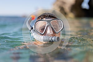 Boy with goggles and pipe before diving portrait