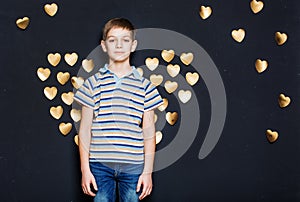 Boy with golden heart wings