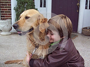 Boy and golden retriever portrait