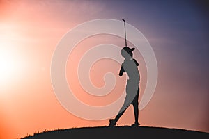 Boy golfer silhouette