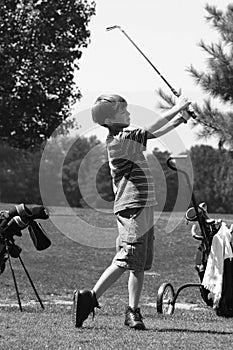 Boy golfing