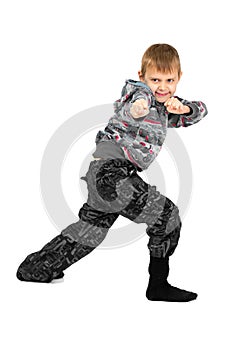Boy grimaces and indulges on a white background. Isolated