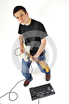 Boy with guitar and an amp