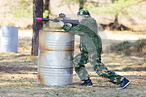 Boy with a gun playing lazer tag