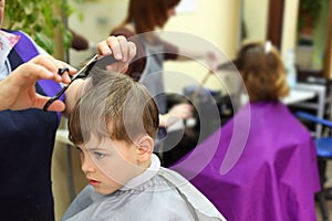 Boy in hairdressing salon