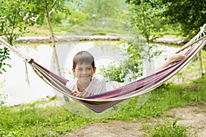 Boy in a hammock on the nature