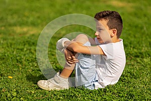 Boy with hand bandaged and gypsum outdoors