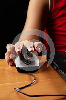 Boy hand on computer mouse