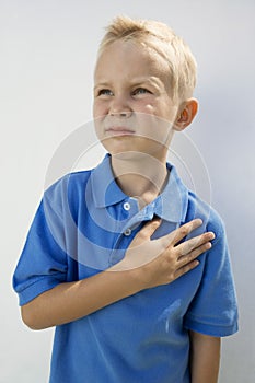 Boy With Hand On Heart
