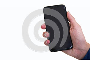 Boy hand holding black modern smartphone with empty screen, isolated on white background. Mockup