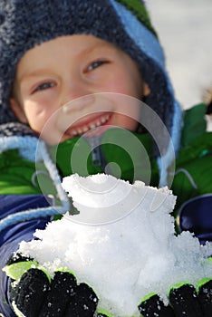Boy with Handful of Snow photo
