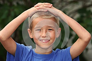 Boy with Hands on Head