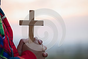 Boy hands holding a holy cross and praying to God, Child Praying for God Religion