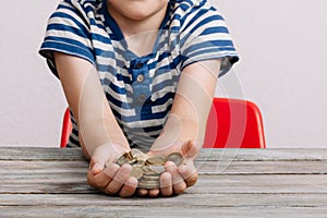 Boy hands holding money coins