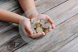 Boy hands holding money coins