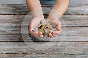 Boy hands holding money coins