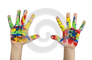 Boy hands painted with colorful paint