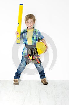 Boy handyman with hard hat, level and tool belt